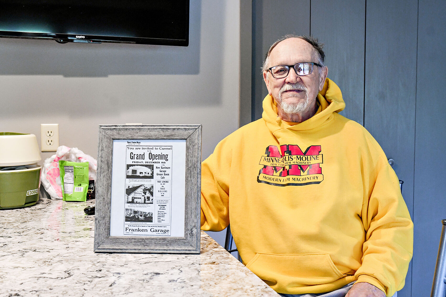 Gene Bartels with newspaper advertisement
